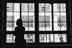 Woman With Addiction Problem Looking Out Window